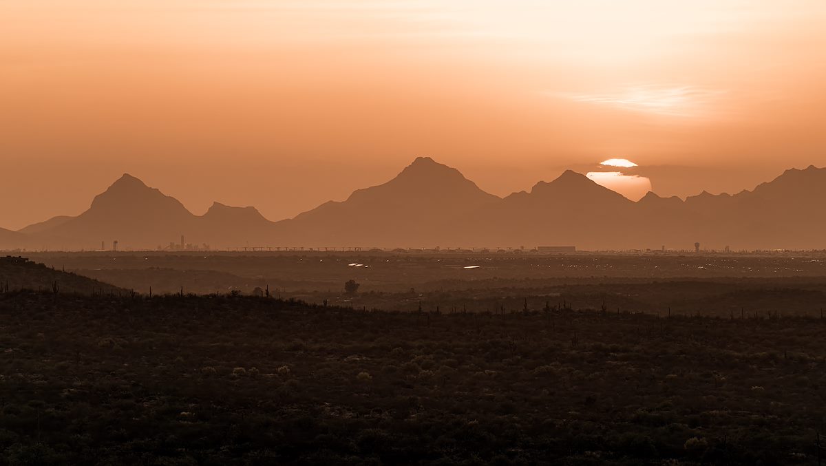 2022 April Sun behind the Tucson Mountains