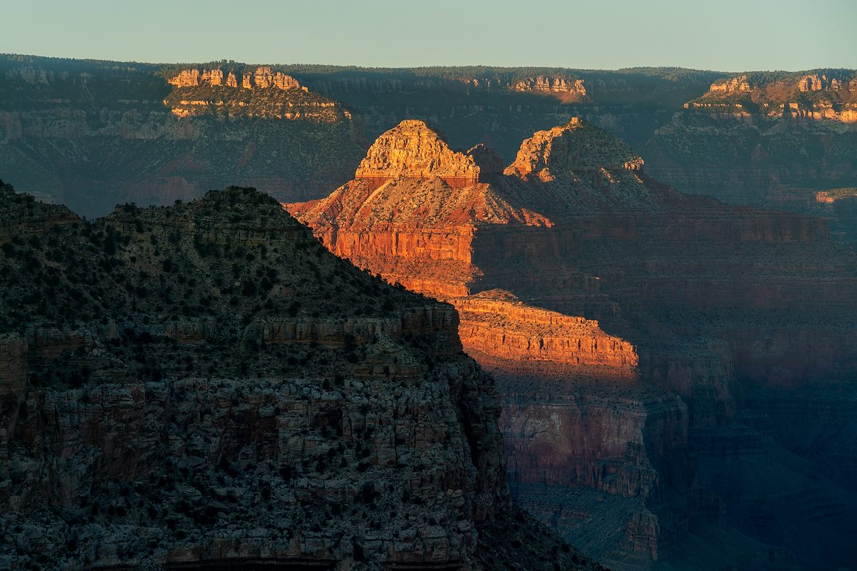 Sunset light on Menicius and Confucius Temples as they rise from the shadows of the inner canyon.