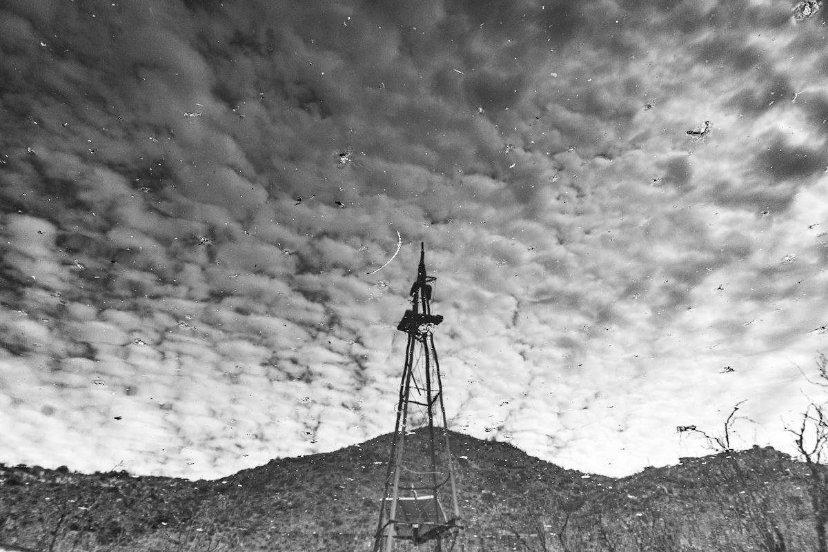 2020 March Windmill reflection in a tank below Crow Windmill