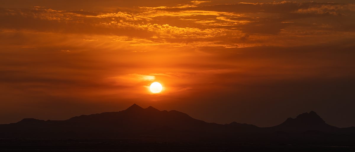 2021 June Setting Sun above the Silver Bell Mountains